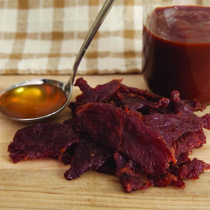 Hofmann Beef Jerky Honey BBQ on table with sauces
