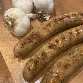 Grilled Hofmann Roasted Garlic Chicken Sausages on cutting board